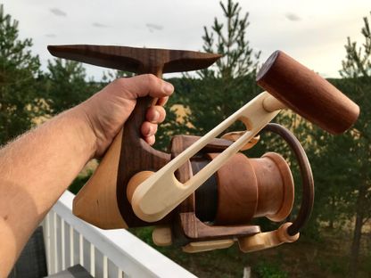Large fishing reel carved out of wood