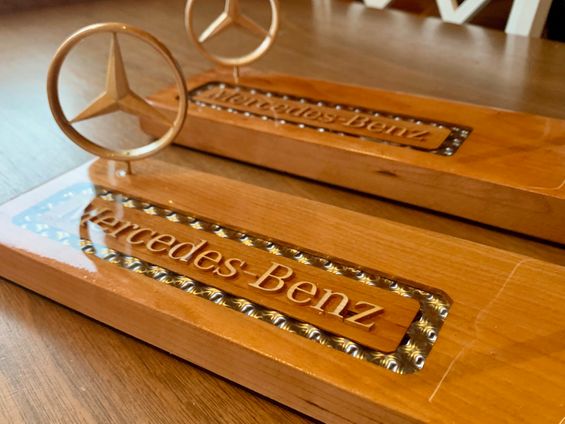 Mercedes-Benz logos carved out of wood