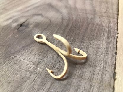 Large fish hook carved out of wood