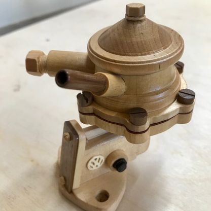 Engine part carved out of wood
