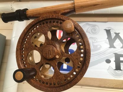 Fishing reel carved out of wood